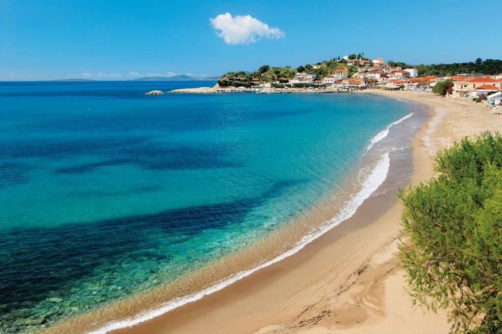 The sandy beach at Finikounda with turquoise water under a clear sky
